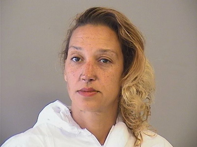 This photo provided by the Tulsa County Sheriff's Office shows Taheerah Ahmad who remains jailed Wednesday, May 16, 2018, after authorities accused her of stabbing one of her daughters and setting their home on fire. Authorities say Ahmad was arrested in downtown Tulsa Tuesday and another daughter who had been reported missing was found safe, police said. (Tulsa County Sheriff's Office via AP)

