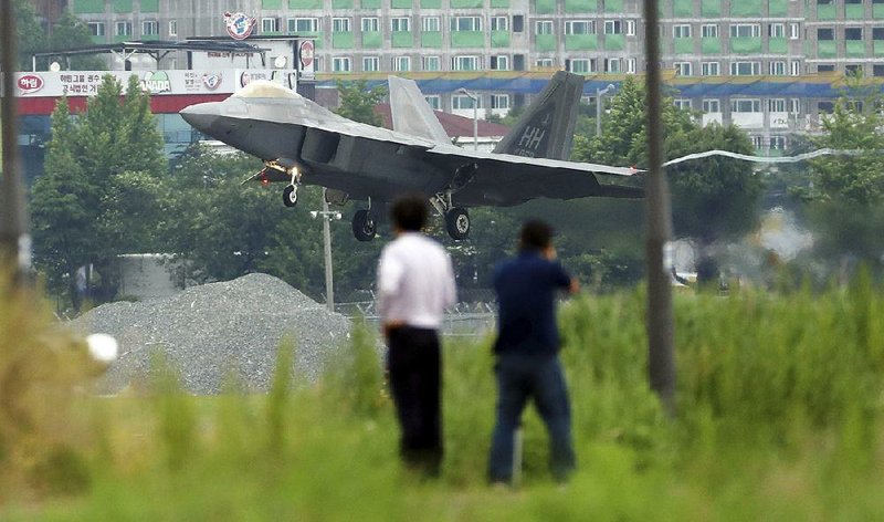 A U.S. F-22 stealth fighter lands Wednesday at an air base in Gwangju, South Korea, during U.S.-South Korean military exercises that North Korea’s news agency called “an intended military provocation.”  