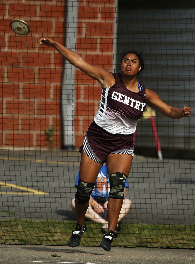 Gentry’s Chastery Fuamatu throws a discus Wednesday during the state high school heptathlon in Cabot. Fuamatu set the state record with a throw of 126 feet, 11½ inches in the event.  