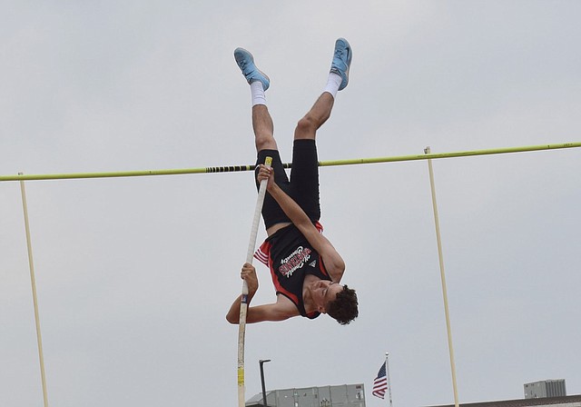 RICK PECK/SPECIAL TO MCDONALD COUNTY PRESS Zack Woods goes inverted on his way to clearing 13-3 to take second place in the pole vault at the Missouri Class 4 District 6 Track and Field Championships on May 12 at Carl Junction High School.
