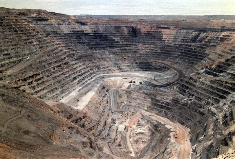 FILE - This undated file photo shows Barrick Goldstrike Mines' Betze-Post open pit near Carlin, Nev. Environmental groups challenged the Trump administration in federal court Wednesday, May 16, 2018, over its rejection of an Obama-era proposal that would have required mining companies to prove they have enough money to clean up their pollution. (Adella Harding/The Daily Free Press via AP, File)