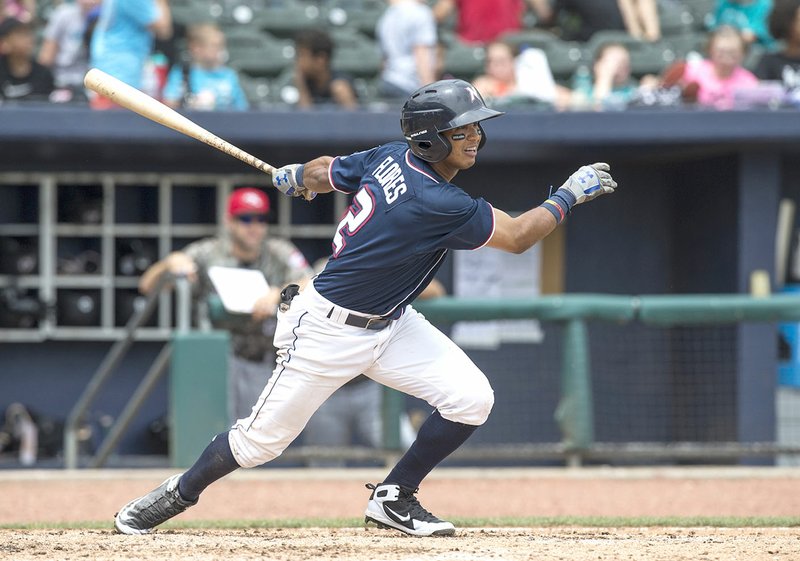 Naturals third baseman Jecksson Flores hits a line drive Wednesday against the Travelers at Arvest Ballpark in Springdale.