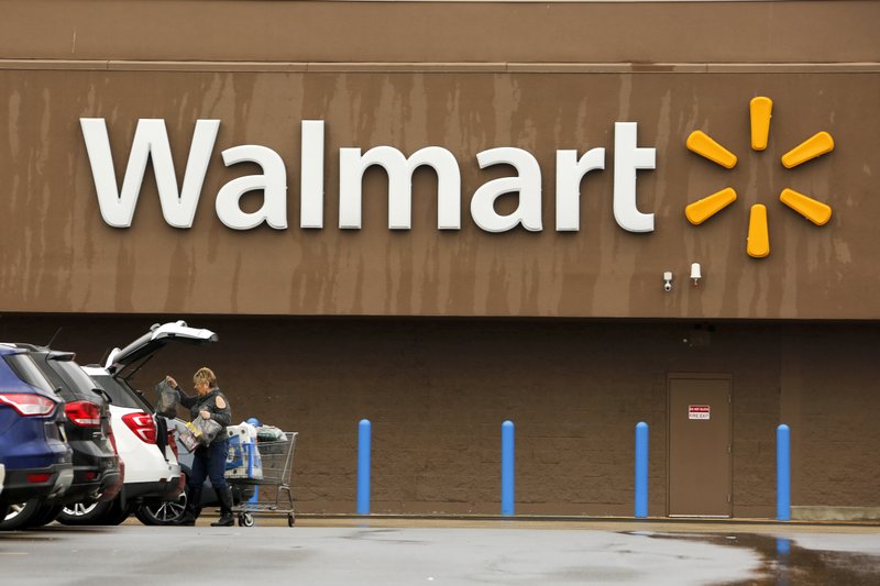 In this Feb. 22 file photo, a shopper loads her car after shopping at a Walmart in Pittsburgh. (AP Photo/Gene J. Puskar, File)
