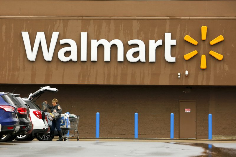 In this Feb. 22, 2018, file photo, a shopper loads her car after shopping at a Walmart in Pittsburgh. Walmart Inc. reports earnings on Thursday, May 17, 2018. (AP Photo/Gene J. Puskar, File)