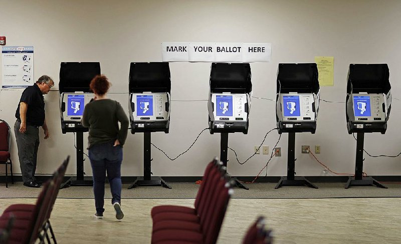 Voting machines like these at a polling site in Conyers, Ga., use touch screens that provide no paper records, making it hard to confirm voters’ choices.  