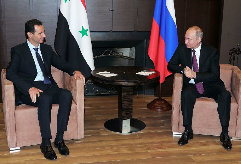 Syrian President Bashar Assad (left) reportedly told Russian President Vladimir Putin in Sochi, Russia, on Thursday that he plans to send a delegation to the U.N. to discuss Syria’s constitution.  