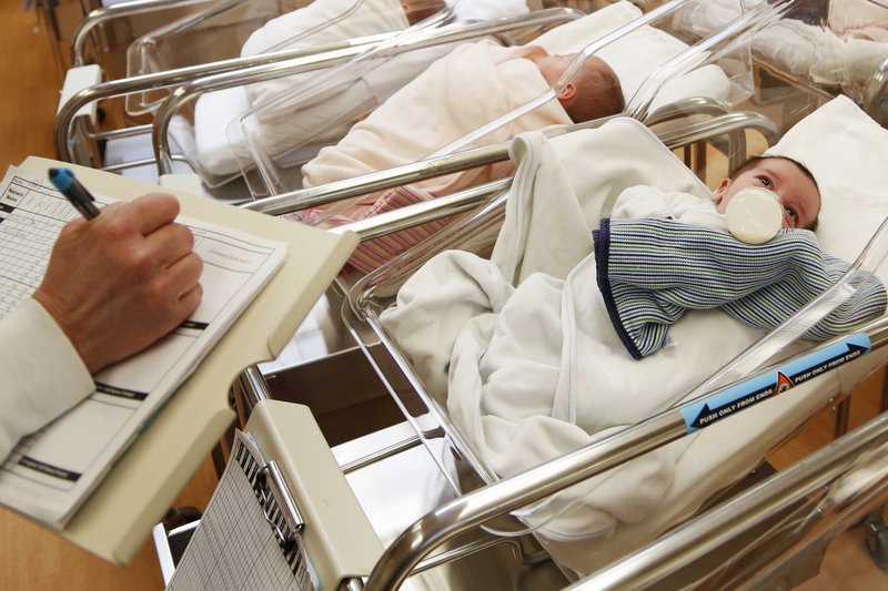 FILE - This Thursday, Feb. 16, 2017 file photo shows newborn babies in the nursery of a postpartum recovery center in upstate New York. According to a Centers for Disease Control and Prevention report released on Thursday, May 17, 2018, 2017 saw the lowest number of U.S. births in 30 years, with birth rates declining not only for women in their teens and 20's but _ surprisingly _ also women in their 30's. (AP Photo/Seth Wenig)