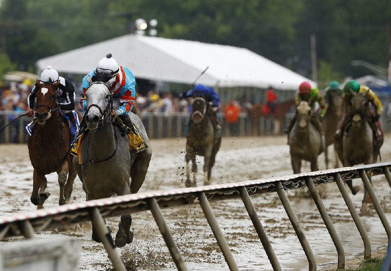 Red Ruby with Paco Lopez aboard wins the Black-Eyed Susan Stakes on Friday at Pimlico Race Course in Baltimore. After taking a two-month layoff, Red Ruby won by 4¾ lengths.  
