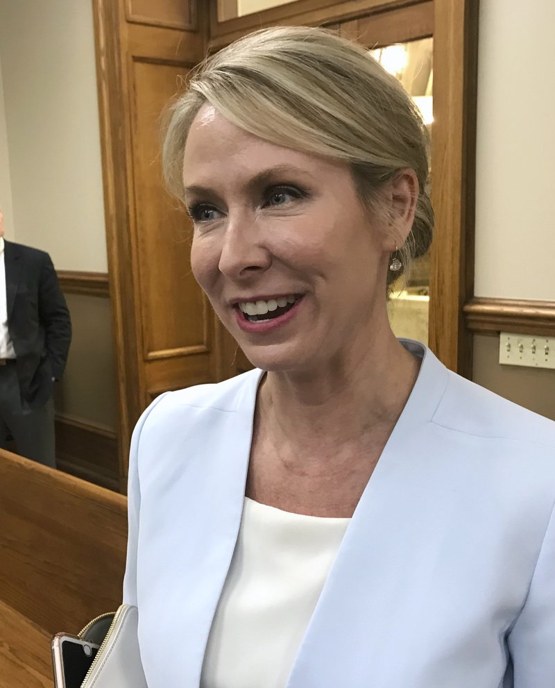 Arkansas Supreme Court Justice Courtney Goodson speaks to reporters at the Pulaski County Courthouse in Little Rock, Ark., on Friday, May 18, 2018. A second Arkansas judge has prevented TV stations from airing a conservative group's ad attacking a Goodson, who is running for re-election. (AP Photo/Andrew DeMillo)