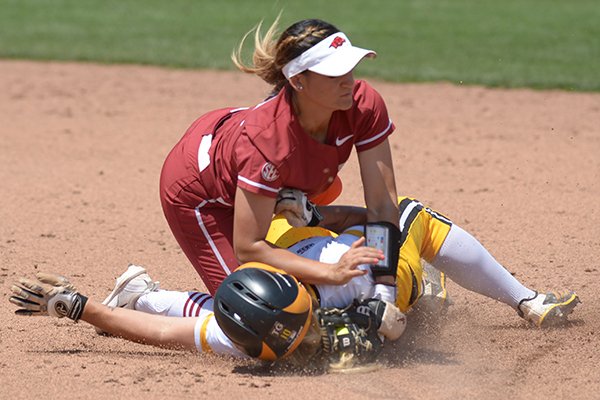 Arkansas second baseman Haydi Bugarin (top) collides with Wichita State third baseman Mackenzie Wright Saturday, May 19, 2018, as Wright comes in safely at the bag during the third inning at Bogle Park during the NCAA Fayetteville Softball Regional on the university campus in Fayetteville.
