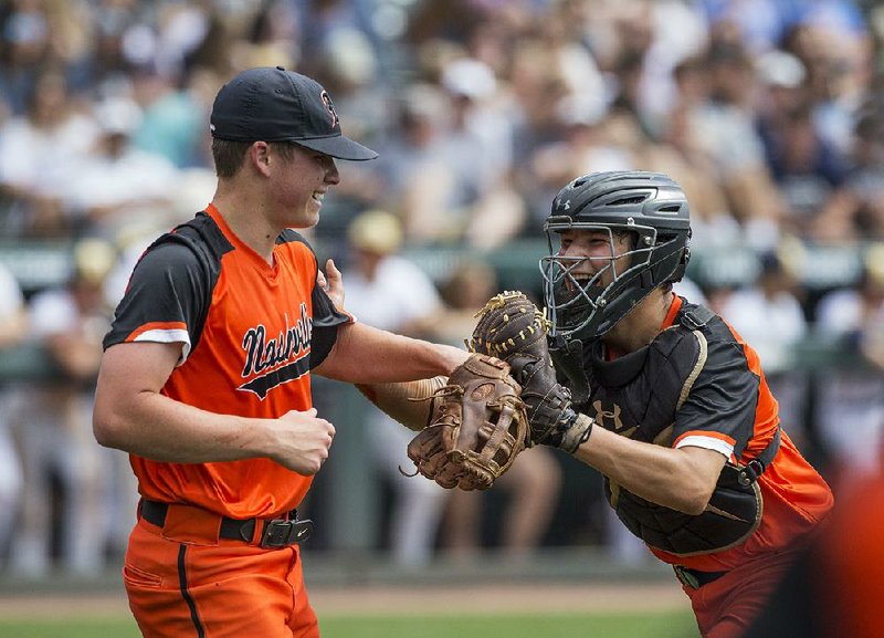 Nashville catcher Colton Patterson (right) congratulates Scrappers pitcher Tyler Hanson after an out to end the third inning Saturday in the Class 4A baseball championship at Baum Stadium in Fayetteville. Hanson pitched a shutout in a 4-0 victory over Shiloh Christian.  
