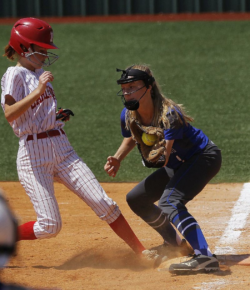 Farmington’s Eliana Marano jumps back to first base ahead of the throw to Greenbrier’s Shelby Coats during the Lady Panthers’ 3-2 victory in the Class 5A state softball championship game Saturday at the Benton Sports Complex.