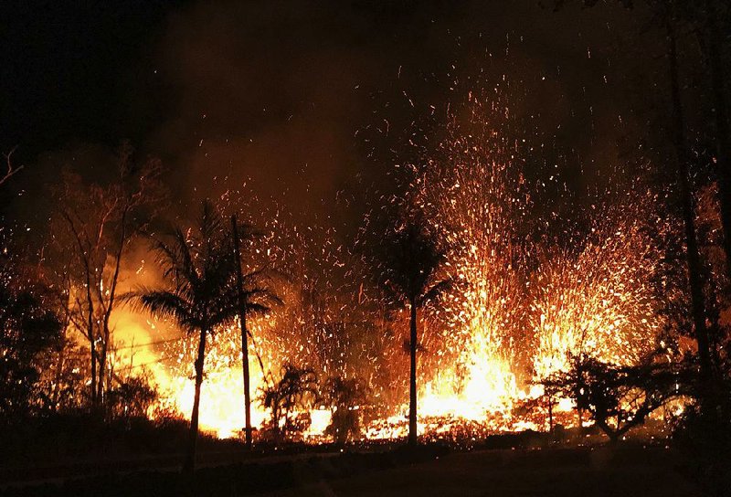 A new fissure erupts in Leilani Estates in Pahoa, Hawaii, earlier this month in this photo provided by the U.S. Geological Survey.  