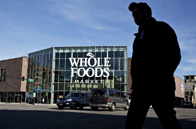 A pedestrian passes in front of the Lakeview Whole Foods Market Inc. store in Chicago in November.  