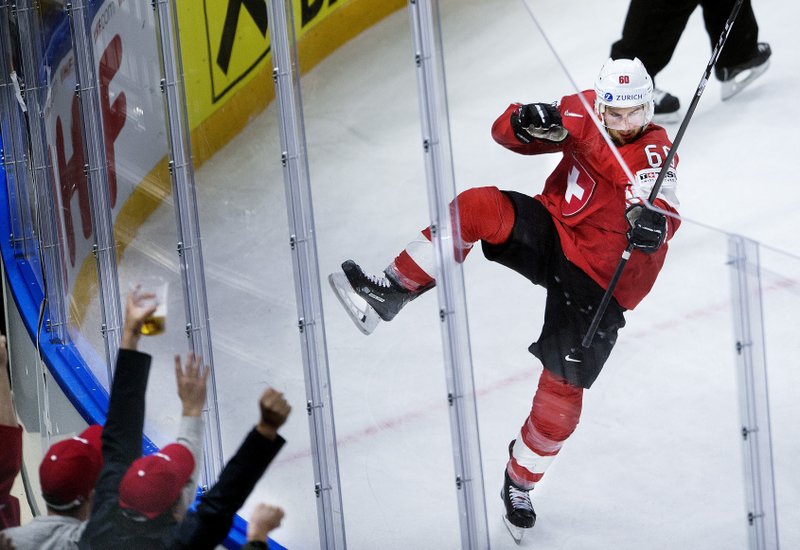 Tristan Scherwey of Switzerland scores the first goal during the IIHF World Championship semi-final ice hockey match between Canada and Switzerland in Royal Arena in Copenhagen, Denmark, Saturday, May 19, 2018. (Liselotte Sabroe/Ritzau Scanpix via AP)