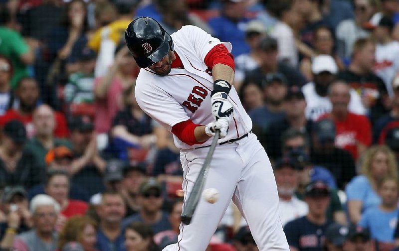 J.D. Martinez hits a two-run home run during the fi fth inning Sunday to help the Boston Red Sox to a 5-0 victory over the Baltimore Orioles on Sunday in Boston. Martinez also homered in the second inning. 