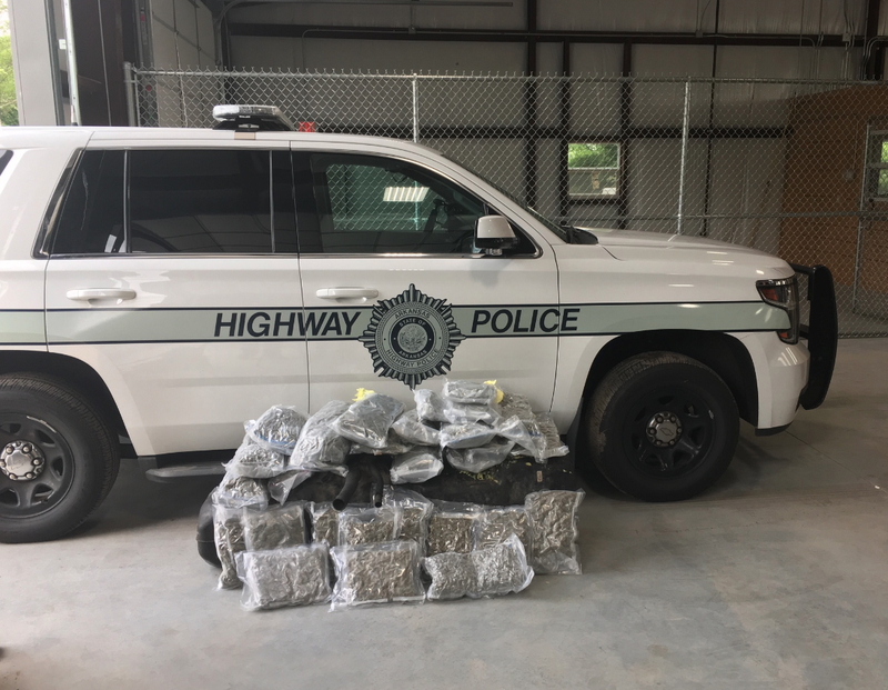 Arkansas Highway Police seized 30 pounds of marijuana found hidden in a pickup that was being hauled on I-40 in Arkansas, authorities said.