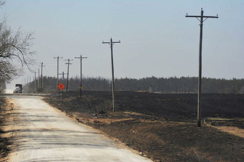 Scorched farmland is shown in this photo taken near Seiling, Okla., in mid-April, when wildfires burned 253,000 acres in the western part of the state. Lack of rain and above-average temperatures are prolonging drought across the Southern Plains that have stressed crops and rangelands and placed new pressures on groundwater sources. 
