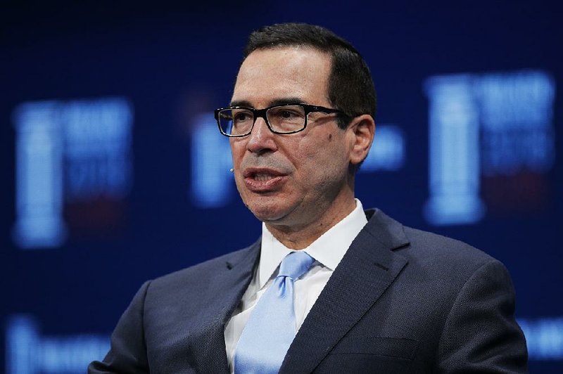 In this April 30, 2018, file photo, Treasury Secretary Steven Mnuchin speaks during a discussion at the Milken Institute Global Conference, in Beverly Hills, Calif.