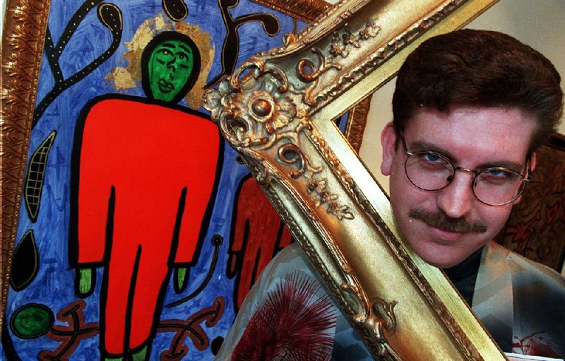 Norman Scott, who signed his art N. Scott, posed for this photo in 1997 with one of his works of art. A show of newly discovered works hangs through June 30 at Cantrell Gallery in Little Rock. 
