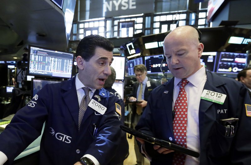 Specialist Peter Mazza, left, and trader Patrick Casey work on the floor of the New York Stock Exchange, Monday, May 21, 2018. Stocks are opening solidly higher on Wall Street after trade tensions between the U.S. and China dissipated. (AP Photo/Richard Drew)