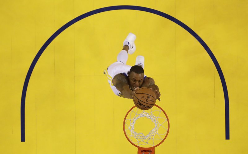 Golden State Warriors' Andre Iguodala goes up for a dunk against the Houston Rockets during the first half in Game 3 of the NBA basketball Western Conference Finals Sunday, May 20, 2018, in Oakland, Calif. (AP Photo/Marcio Jose Sanchez)