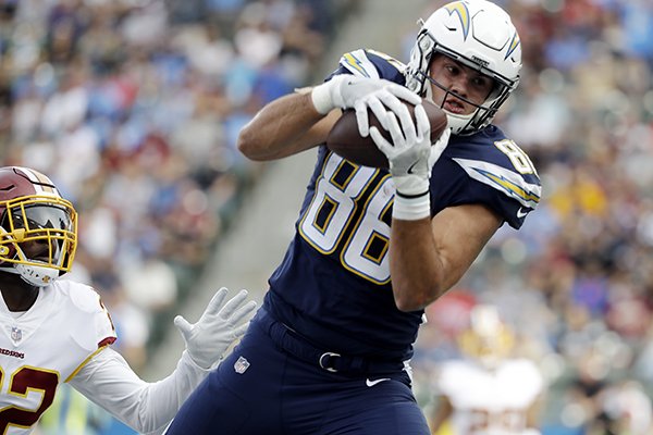 Los Angeles Chargers tight end Hunter Henry makes a touchdown catch during the first half of an NFL football game as Washington Redskins safety Deshazor Everett looks on Sunday, Dec. 10, 2017, in Carson, Calif. (AP Photo/Alex Gallardo)

