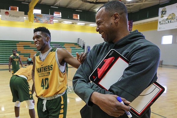 Philander Smith College basketball coach Todd Day, right, jokes with player Rolandis Hall during a practice Jan. 26, 2017, in Little Rock. 
