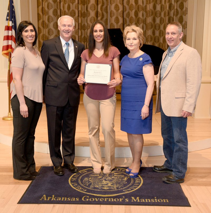 SUBMITTED Hannah Boss (center), along with her parents Kelly Lange (left) and Paul Boss (right), is receiving her certificate from Gov. Asa Hutchinson and first lady Susan Hutchinson on April 28 at the Governor's Mansion in Little Rock.