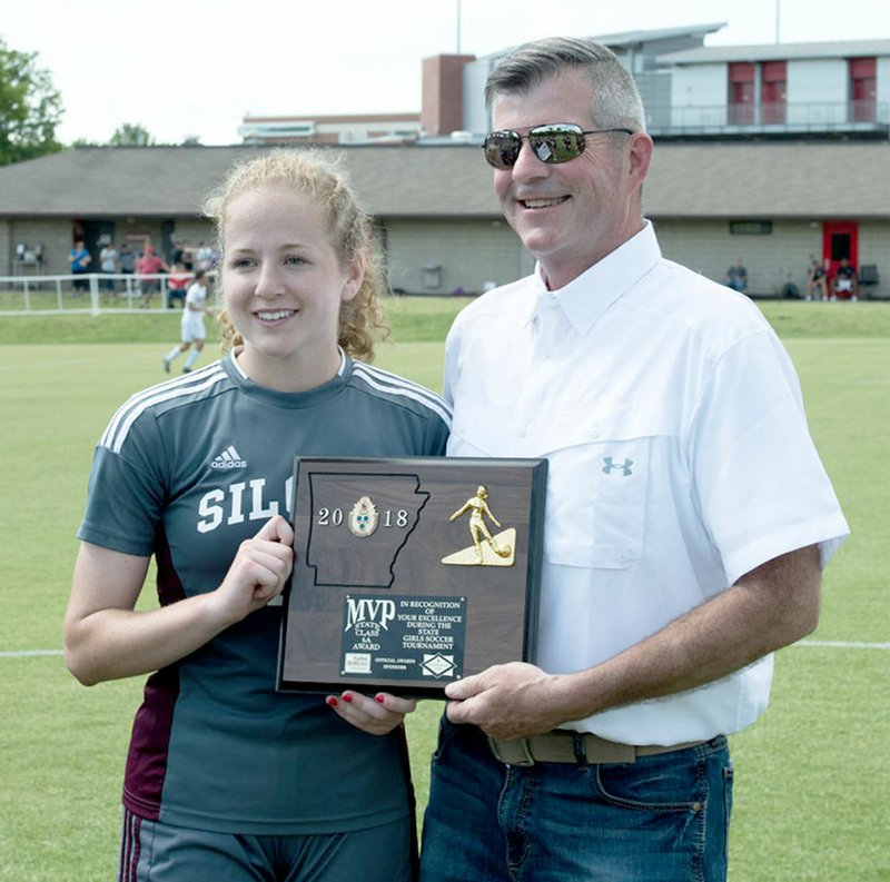 Bud Sullins/Special to the Herald-Leader Siloam Springs senior Megan Hutto was presented with the 6A state championship MVP plaque last Friday after Siloam Springs defeated Benton 1-0 for its fifth-straight state title. Hutto also earned MVP honors as a freshman in 2014.