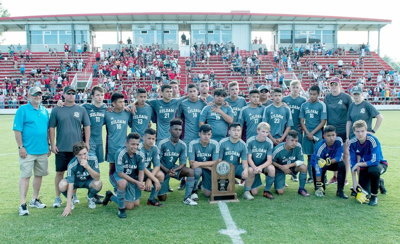 Bud Sullins/Special to the Herald-Leader The Siloam Springs boys take a picture with the 6A state runner-up trophy on Friday after losing to Russellville 4-1 in the Class 6A state championship game at Razorback Field in Fayetteville.