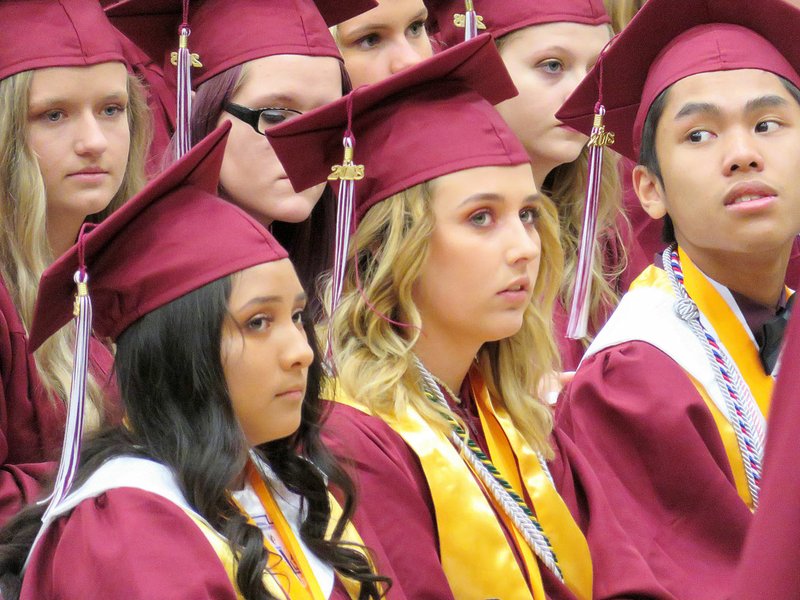 Westside Eagle Observer/RANDY MOLL Seniors watches as their classmates received their diplomas at Gentry High School graduation ceremonies in Siloam Springs on Sunday, May 20, 2018.