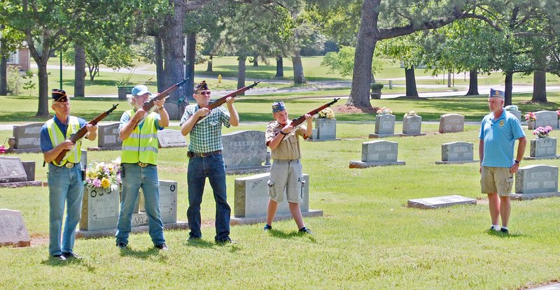 Janelle Jessen/Herald-Leader American Legion Post 29 members Bennie Gallant, Sam Grimes and Gary Deiker, and Boy Scout Josh Robinson Jr., under the command of Stuart Reeves, gave a three volley salute to Mickey Jewell, a World War II Army Nurse, during a ceremony at Oak Hill Cemetery on Saturday. Each year American Legion Post 29 members place about 700 flags on veterans' graves in the cemetery the weekend before Memorial Day. Last year, they started the tradition of honoring at least one veteran with a brief ceremony. The American Legion is hosting a Memorial Day Service at 10 a.m. Monday, May 28, in the American Legion Community Building. State Rep. Robin Lundstrum (R-District 87) will be the guest speaker.