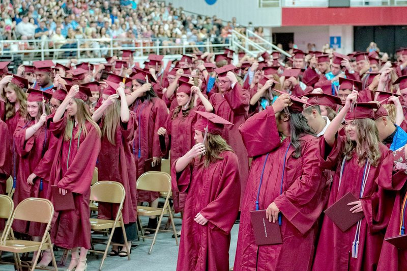 Bud Sullins/Special to the Herald-Leader Siloam Springs graduates turn their tassle at the 2018 graduation ceremony Saturday, May 19, at Barnhill Arena on the campus of the University of Arkansas in Fayetteville.