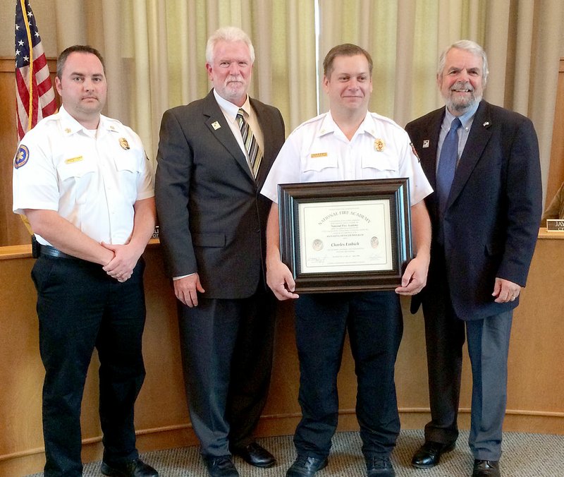 Janelle Jessen/Herald-Leader Battalion Chief Charlie Embich was recognized at the May 15 City Board meeting for completing the National Fire Academy's Managing Officer Program. Pictured are Fire Chief Jeremey Criner, City Administrator Phillip Patterson, Embich and Mayor John Turner.