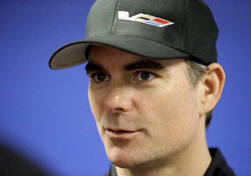 In this Jan. 27, 2017, file photo, Jeff Gordon speaks with reporters after a practice session for the IMSA 24-hour auto race at Daytona International Speedway in Daytona Beach, Fla. 