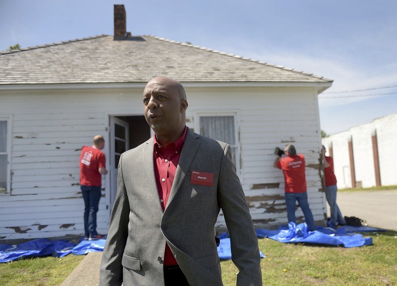 FILE- In this April 18, 2017, file photo, Marvin Ellison, CEO of J.C. Penney Co., visits the boyhood home of the company's founder James Cash Penney in Hamilton, Mo. J.C. Penney's CEO is leaving the company to become the top executive at Lowe's. The announced departure of Ellison on Tuesday, May 22, 2018, sent shares of the besieged department store tumbling more than 12 percent to what may become an all-time low. (Jessica A. Stewart/The St. Joseph News-Press via AP, File)