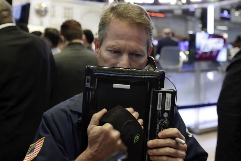 Trader Robert Charmak works on the floor of the New York Stock Exchange, Tuesday, May 22, 2018. U.S. stocks are making modest gains as energy companies rise with oil prices and banks also move higher. (AP Photo/Richard Drew)