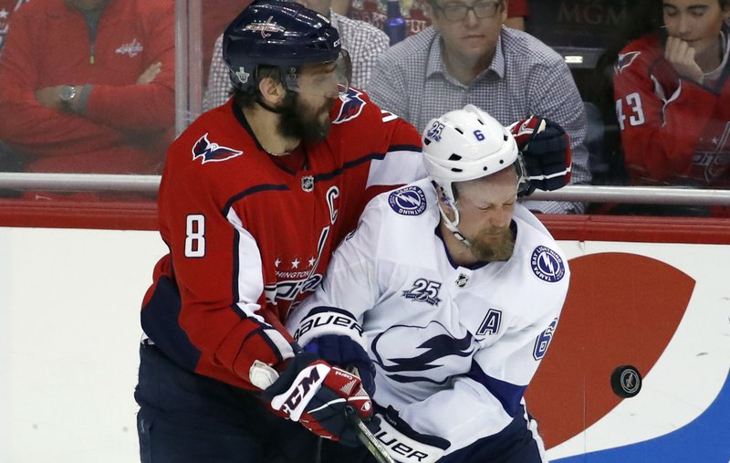 Washington Capitals left wing Alex Ovechkin (8), from Russia, collides with Tampa Bay Lightning defenseman Anton Stralman (6), from Sweden, during the third period of Game 6 of the NHL Eastern Conference finals hockey playoff series, Monday, May 21, 2018, in Washington. The Capitals won 3-0. (AP Photo/Alex Brandon)