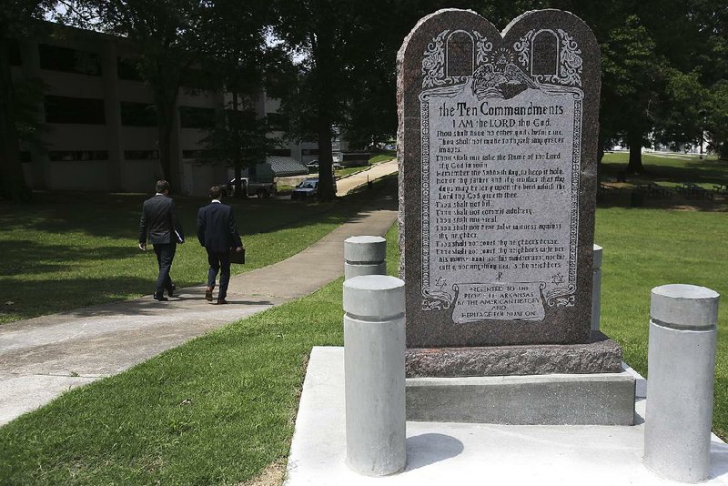 The Ten Commandments monument, which sits near the state Capitol in Little Rock, violates the First Amendment mandate for religious neutrality, according to two lawsuits seeking its removal.  
