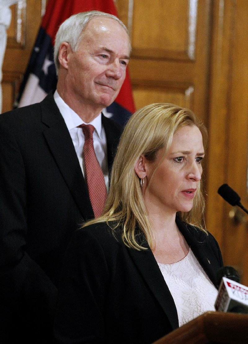 Arkansas Attorney General Leslie Rutledge talks about the school safety commission as Governor Asa Hutchinson looks on in this file photo.