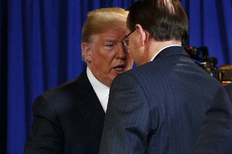President Donald Trump and Deputy Attorney General Rod Rosenstein talk Wednesday after a round-table discussion on the MS-13 gang in Bethpage, N.Y. Trump and Rosenstein, a frequent target of the president’s anger over the Russia investigation, appeared on good terms during the session. 