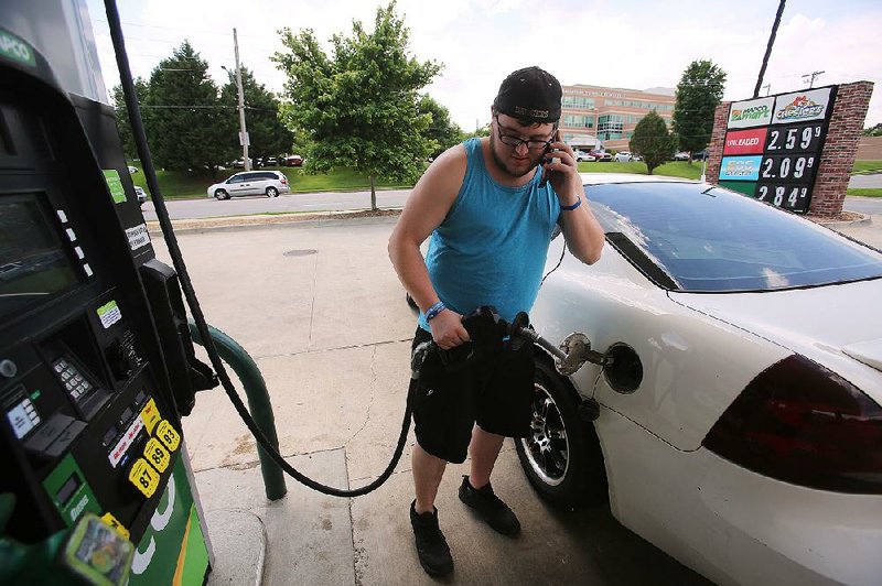 FILE — Dillon Lindsey of Beebe fills up his car at the Mapco gas station on Springhill Road in North Little Rock in this May 23, 2018, file photo. 