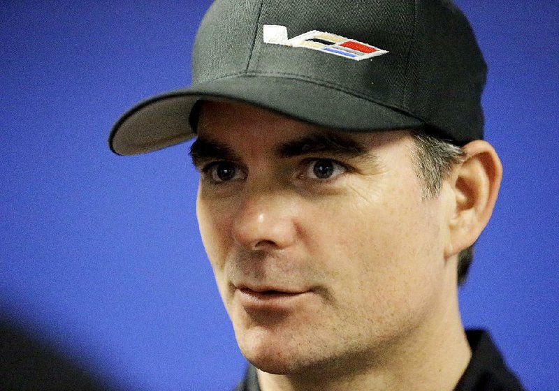  In this Jan. 27, 2017, file photo, Jeff Gordon speaks with reporters after a practice session for the IMSA 24-hour auto race at Daytona International Speedway in Daytona Beach, Fla. 