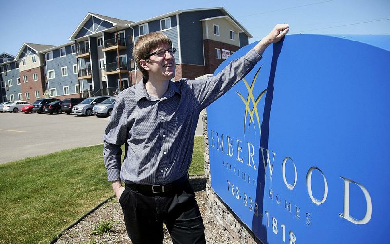 Mike Kaeding tours one of his company’s apartment complexes in Blaine, Minn., recently. He is still in the dark about how his real estate development and management company will be affected by federal tax changes passed in December.  