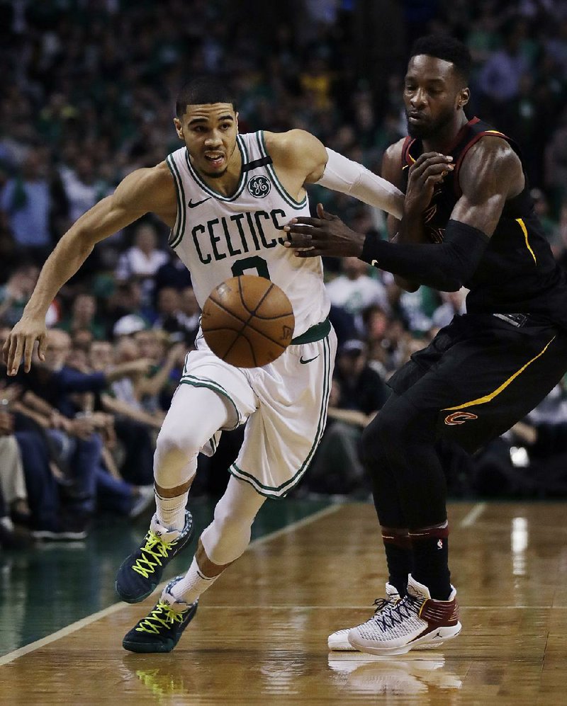 Jayson Tatum (left) of the Boston Celtics tries to dribble past Jeff Green of the Cleveland Cavaliers on Wednesday night in Game 5 of the NBA Eastern Conference finals. Tatum scored 24 points to lead the Celtics to a 96-83 victory. 