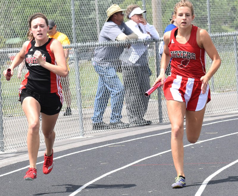 RICK PECK/SPECIAL TO MCDONALD COUNTY PRESS Ragan Wilson runs the opening leg of the 4x800 relay at Saturday's sectional track meet at Carthage High School.