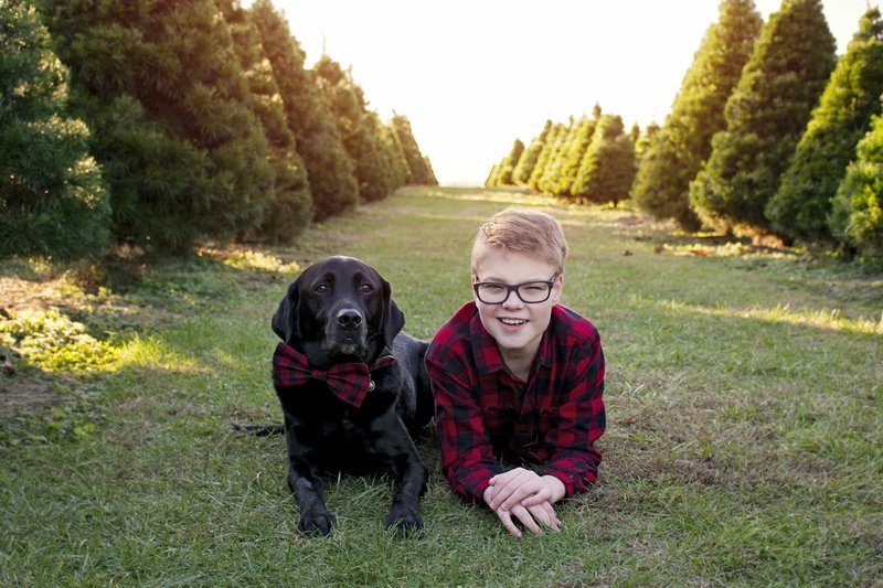 Courtesy photo Samuel Spencer and Data look dapper and inseparable as they pose for family photos. Data served Samuel as a certified companion animal for five years, before contracting cancer. Today, Data is retired, but remains with the family as a much-loved pet.