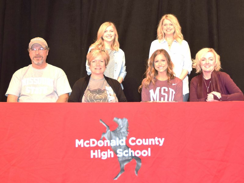 RICK PECK/SPECIAL TO MCDONALD COUNTY PRESS Chloe Morris (seated, third from left) recently signed to join the Sugar Bears dance team at Missouri State University. Front row, left: Parents Jay Morris and Melody Morris, Chloe Morris and Susan Brown, Sugar Bears coach. Back row, left: Eden LeGrand and Sandra Ables.