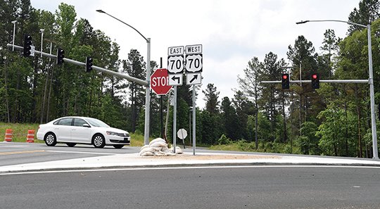 The Sentinel-Record/Grace Brown SIGNAL OPERATING: A new traffic signal at the intersection of Highway 70 east and Highway 128 was set to flash on Wednesday, as the Arkansas Department of Transportation prepares to fully open the newly widened Highway 70 after the holiday weekend.